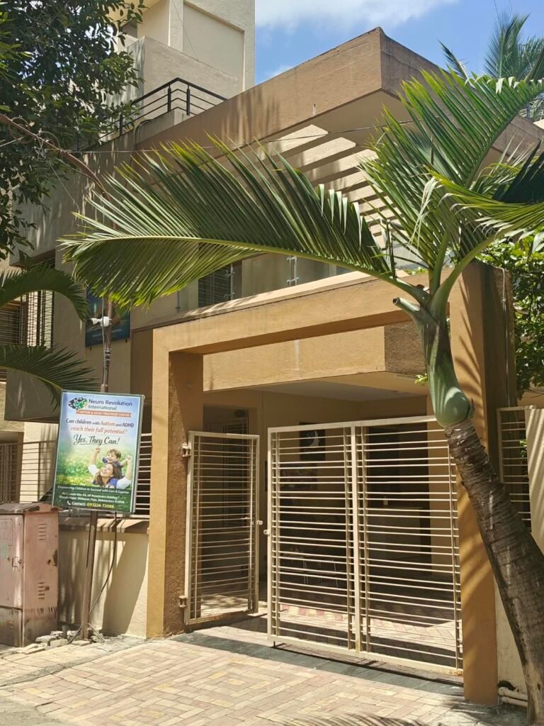 Neuro Revolution International signboard for Autism, ADHD and Special Needs Treatment Center, with clinic address and contact number